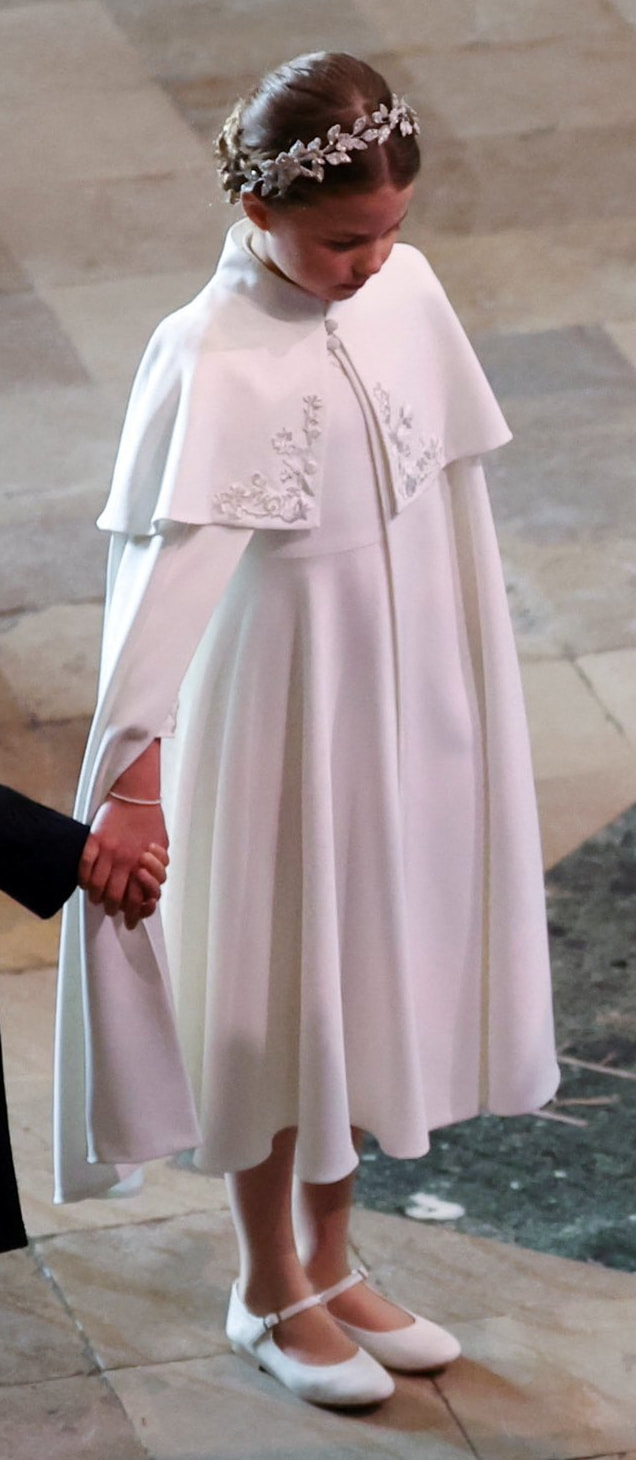 Princess Charlotte twinned with her mother in a bespoke ivory Alexander McQueen silk crepe dress and cape for the coronation of King Charles III